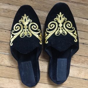 Black slippers with gold embroidery